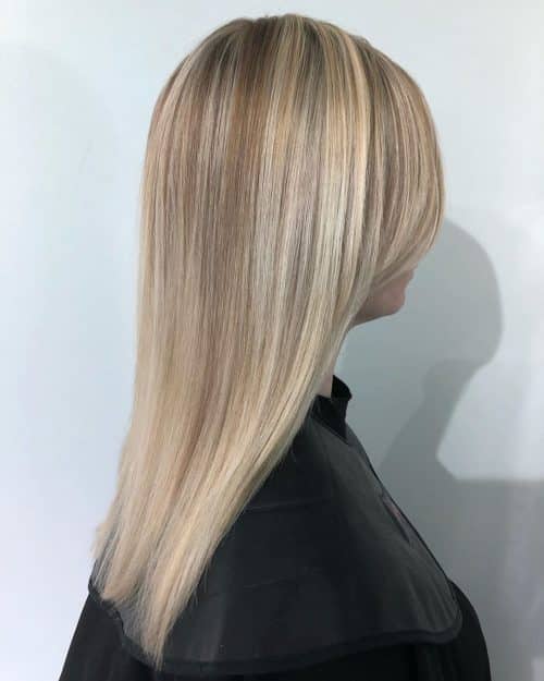 blunt cut long hair with side bangs